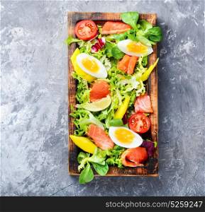 Lettuce salad with salmon. Diet salad with salmon,mango and fresh lettuce