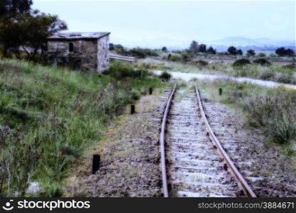 level crossing house in abandoned rail line, with midnight effect