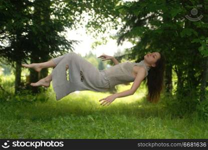 levitation, the sleeping girl in the woods
