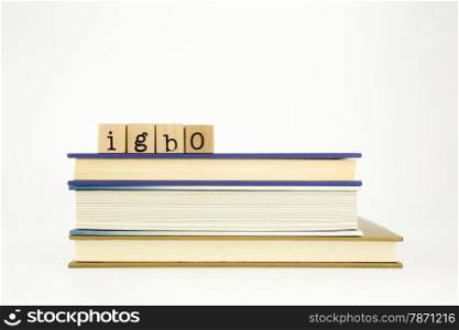 lgbo word on wood stamps stack on books, academic and language concept