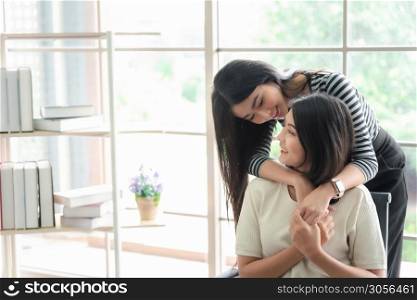 LGBT, Asian women lesbian couple working together as teamwork in business office