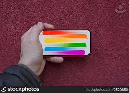 lgbt flag on the screen of the phone