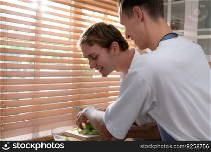 LGBT young couple heads into the kitchen to make a fruit and vegetable salad for the dinner meal.