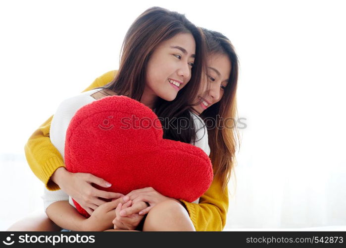 LGBT, Young cute asia lesbians huging and holding red heart shape willow together with happy smiling, couple lesbians, valentine?s day concept