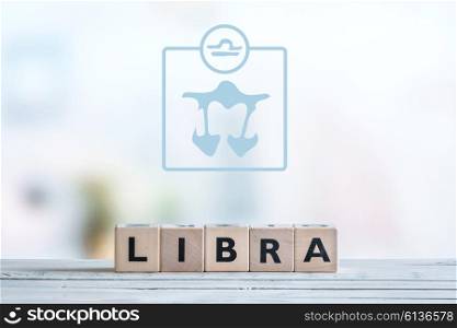 Libra star sign on a wooden table