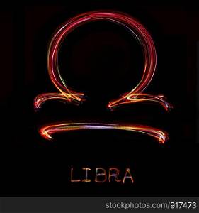 ""Libra",Zodiac sign from led light on black background. "