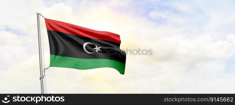 Libya flag waving on sky background. 3D Rendering