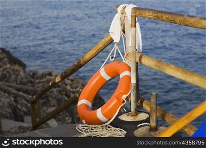 Life belt near a wooden railing, Capri, Campania, Italy
