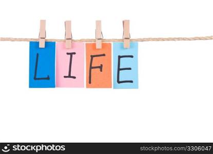 Life, Colorful words hang on rope by wooden peg