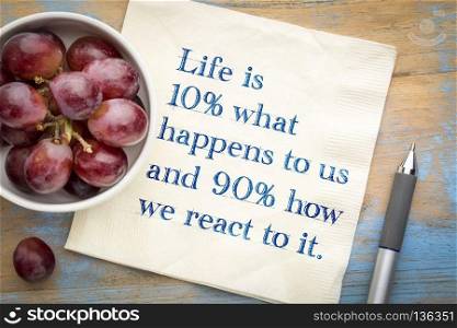 Life is 10  what happens to us and 90  how we react to it - inspiarational handwriting on napkin.