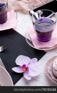 life style concept.Thai blue, Butterfly pea tea served with fresh figs and panna cotta cake and fruit piece of cake on serving napkins.