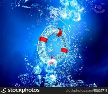Lifebuoy in blue sea. Life insurance concept with life buoy sink in clear blue water