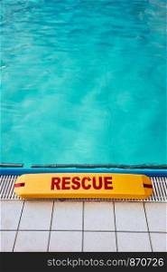 Lifesaver equipment on swimming pool. Candid people, real moments, authentic situations