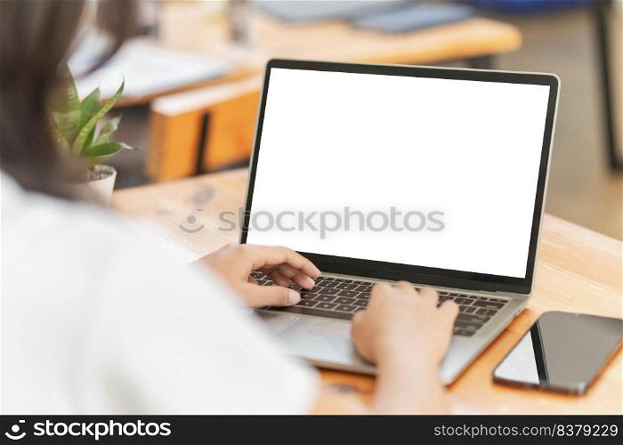 Lifestyle and technology concept, Young Asian woman using laptop and smartphone to working at home.