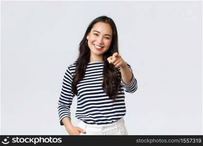 Lifestyle, beauty and fashion, people emotions concept. Happy cheerful asian girl praising you, picking person, found excellent employee for job position, pointing camera and smiling.. Lifestyle, beauty and fashion, people emotions concept. Happy cheerful asian girl praising you, picking person, found excellent employee for job position, pointing camera and smiling