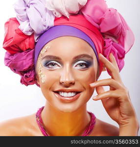 Lifestyle. Beauty. Portrait of young happy toothy smiling woman in colorful headwear