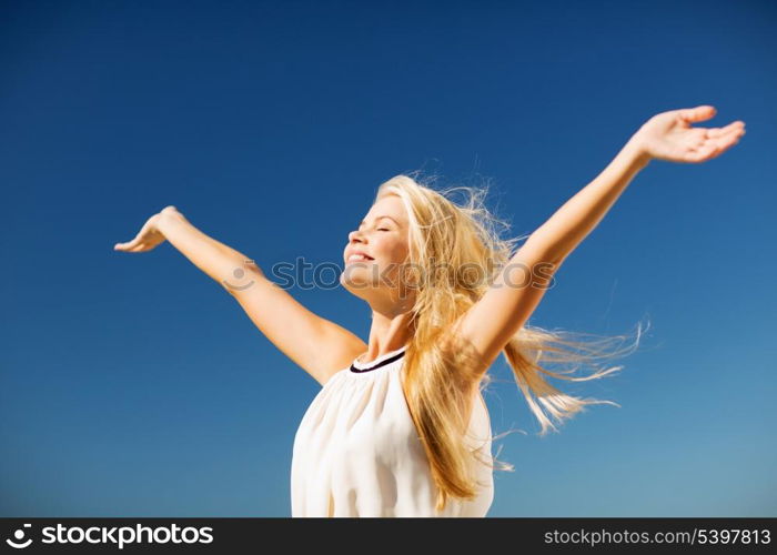 lifestyle concept - beautiful happy woman enjoying summer outdoors