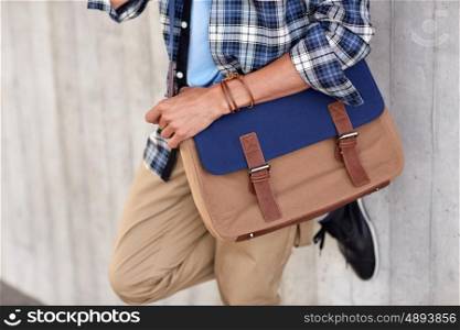 lifestyle, fashion, style and people concept - close up of hipster man with stylish shoulder bag