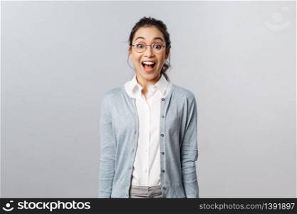 Lifestyle, people and emotions concept. Super good news. Cheerful, excited happy young enthusiastic asian woman in glasses hear incredible great info, open mouth and smiling amazed.. Lifestyle, people and emotions concept. Super good news. Cheerful, excited happy young enthusiastic asian woman in glasses hear incredible great info, open mouth and smiling amazed