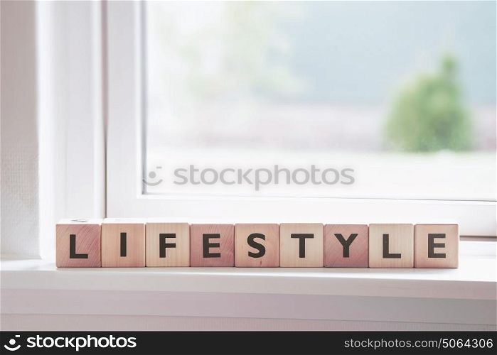 Lifestyle sign in a window in a bright room