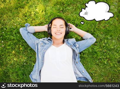 lifestyle, summer vacation, technology, music and people concept - smiling young girl in headphones lying with closed eyes on grass