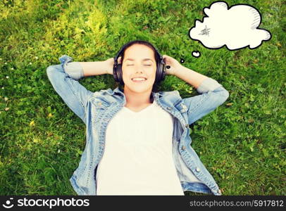 lifestyle, summer vacation, technology, music and people concept - smiling young girl in headphones lying with closed eyes on grass