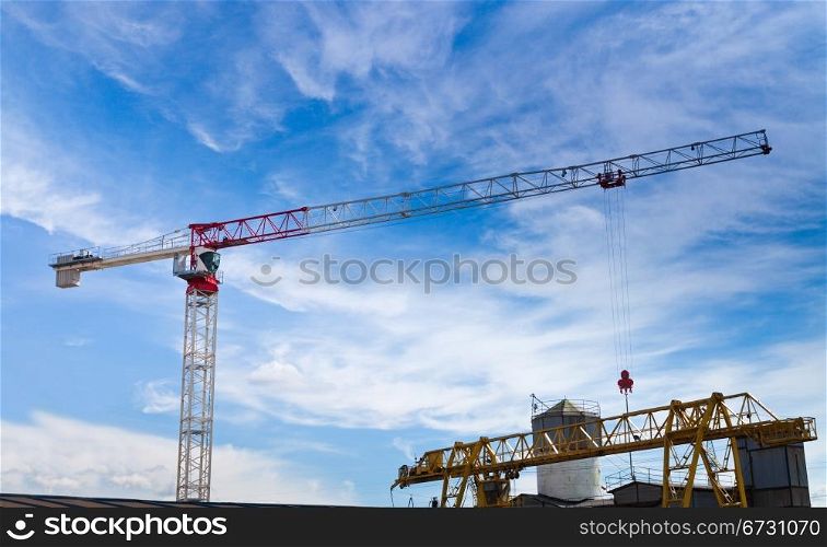 lifting crane under dark blue sky