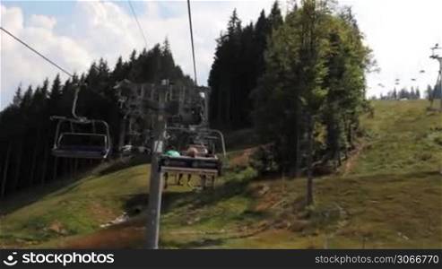 lifting funicular among trees on top of mountain, timelapse