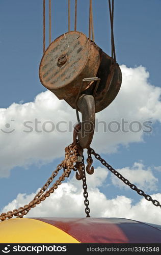 Lifting hook on an old railroad crane with chains