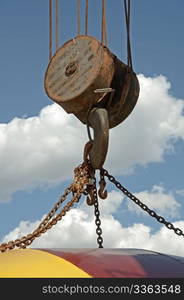 Lifting hook on an old railroad crane with chains