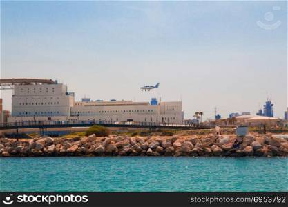 Light aircraft landing above the sea. Mediterranean coast, Tel Aviv, Israel.