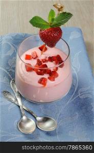Light and delicate yogurt with slices of fresh strawberries