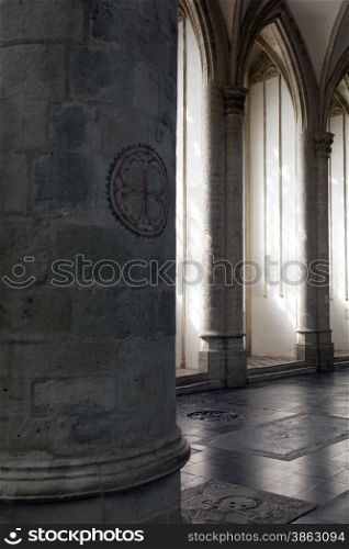 light and shadow formed by pilars in cathedral of dutch town breda