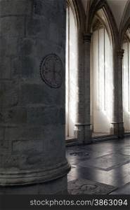 light and shadow formed by pilars in cathedral of dutch town breda