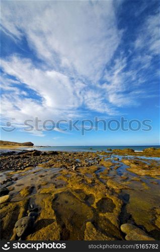 light beach water in lanzarote isle foam rock spain landscape stone sky cloud
