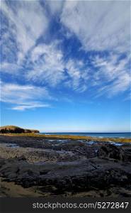 light beach water in lanzarote isle foam rock spain landscape stone sky cloud