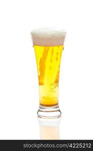 light beer with the foam in a tall glass isolated on white