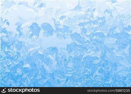 Light blue frozen window glass background