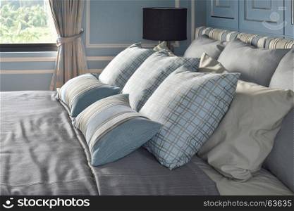 Light blue pillows in difference pattern with classic style bedding