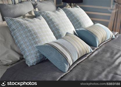 Light blue pillows in difference pattern with classic style bedding