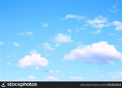 Light blue sky and clouds, may be used as background