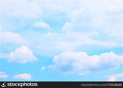 Light blue sky and white clouds, may be used as background