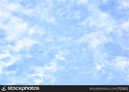 Light blue sky with clouds - abstract background