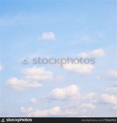 Light blue spring sky with clouds - background, space for your own text