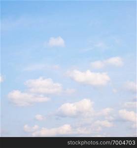Light blue spring sky with clouds - background, space for your own text