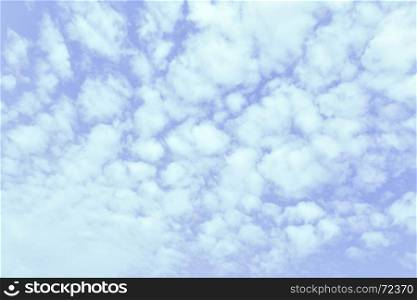 Light blue spring sky with clouds, may be used as background