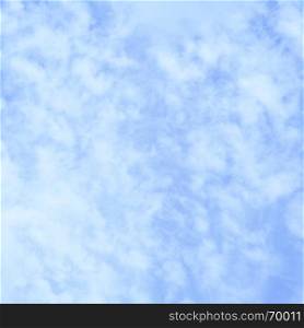 Light blue spring sky with clouds, square cropping