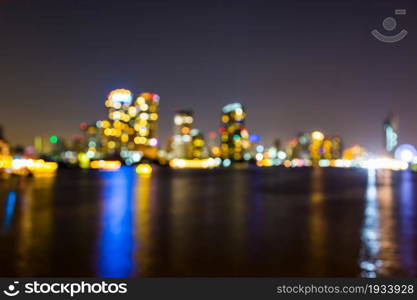 light bokeh of city on the river at night background