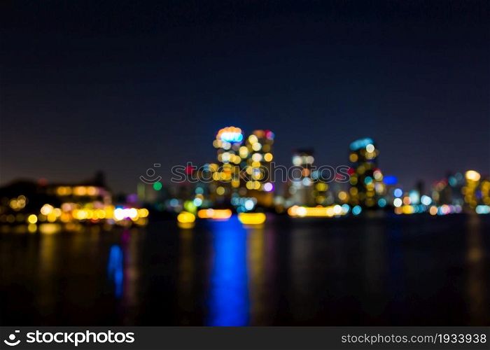 light bokeh of city on the river at night background