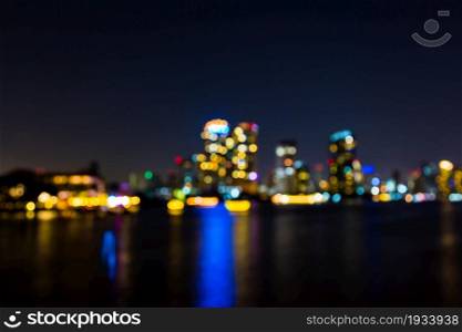 light bokeh of city on the river at night background